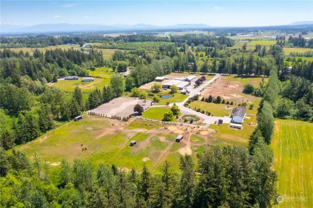 Whatcom county horse facility and privacy on over 18 acres. Multiple fenced pastures, riding perimeter trail, indoor and outdoor arenas, 36 stalls total and a nearly 4000 sqft home. Welcome home!