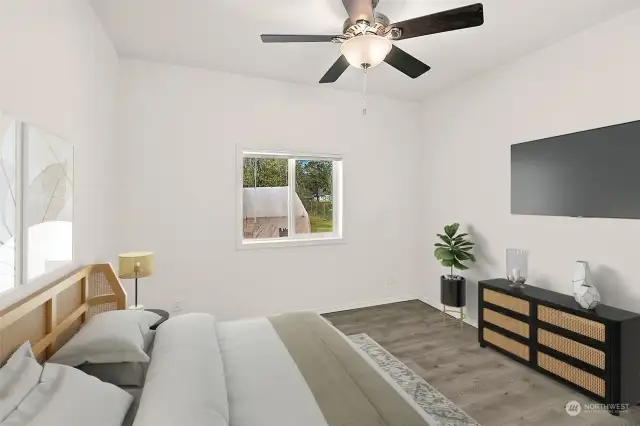 First bedroom is bright, comforting ceiling fan, large closet