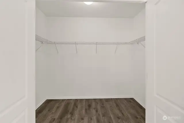 Very generous sized walk-in closet. Adding organizers will accommodate any clothes or shoe hound!