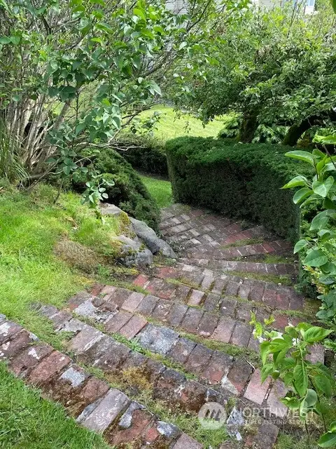 Brick walk way, West edge of the home at 1926. Walk goes down to lot.