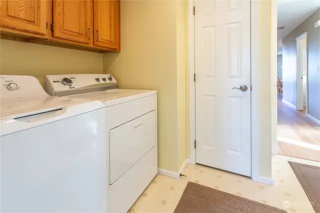 Laundry room with closet