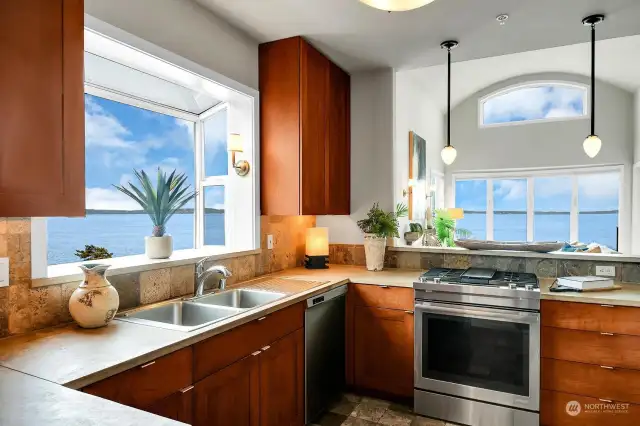 Concrete counters, natural wood cabinets, a big garden window and endless views from this kitchen.