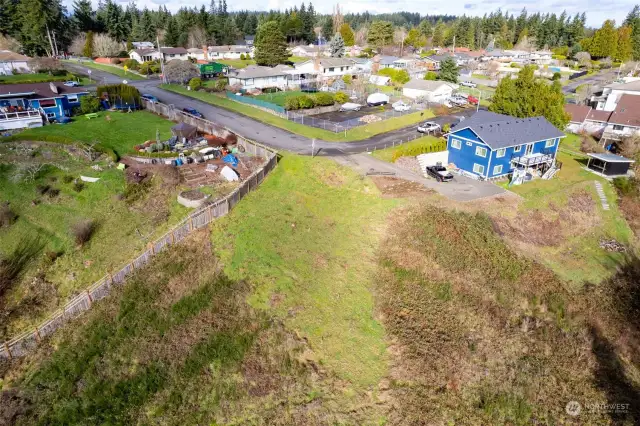 Drone shot, looking back towards the neighborhood. You have a better look at your building site area.