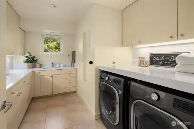 2nd level laundry with lots of storage, long counters, deep soaking sink, built-in ironing board, LG 7.4 Stackable Smart Gas Dryer with steam and Built-in Intelligence, (new 2022) L.G. 5.0 High Efficiency Smart Front-load Washer with Steam and Built in Intelligence.