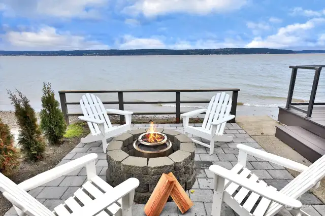 Many cozy times await by the fire pit on the patio.