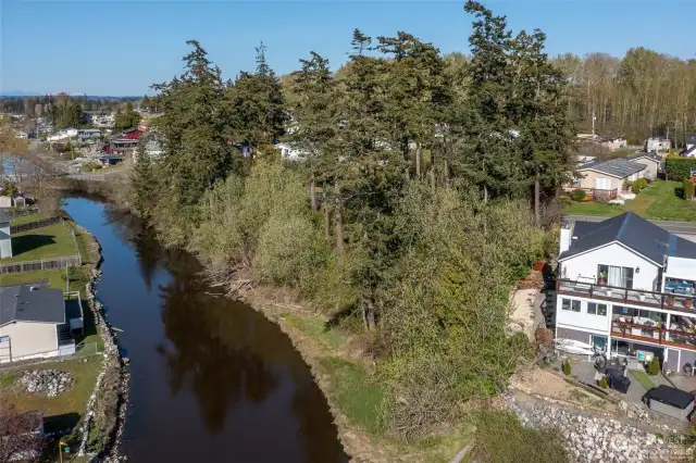 Spectacular western views with sunsets, Terrell Creek bordering property, central location to public beaches, Birch Bay State Park, boating, plus water activities including kayaking with creek to bay access.