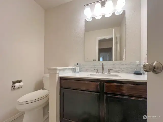 Newly updated counter top and sink in this spacious powder room