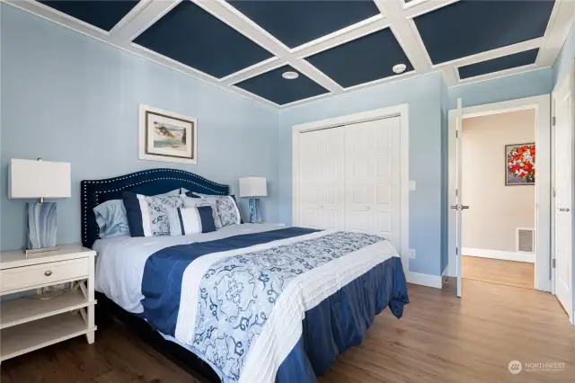 Upstairs also features a large guest suite - with an Ensuite bathroom and ceiling with gorgeous custom molding.