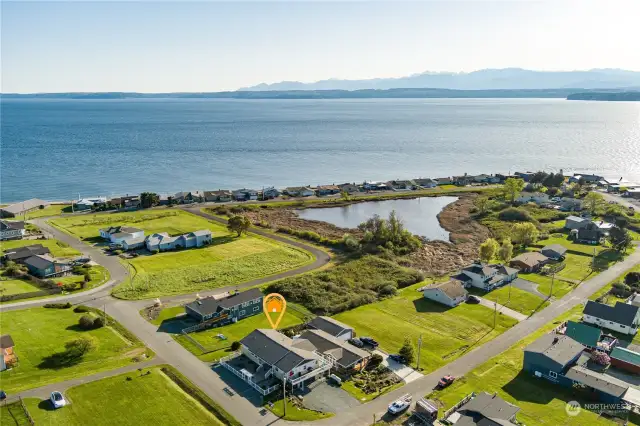 Lovely drone shot of the home nestled in this beautiful waterfront community.