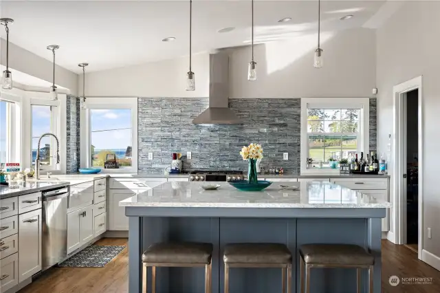 There are so many details in this kitchen just waiting to be discovered, from the clever storage solutions around the island to the custom backsplash.  And let's not forget that natural light streaming through the windows—it's simply stunning!
