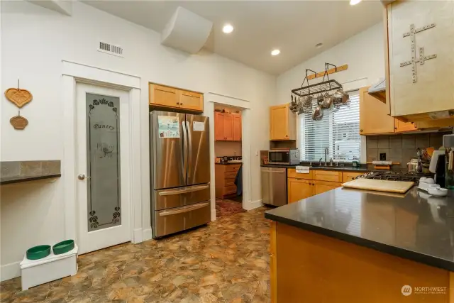 ADU - Beautiful kitchen with quartz countertops, double oven and walkin pantry. Laundry room is off kitchen with pass way to garage.