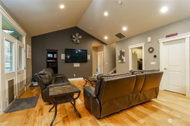 Living room with doors leading to back yard.