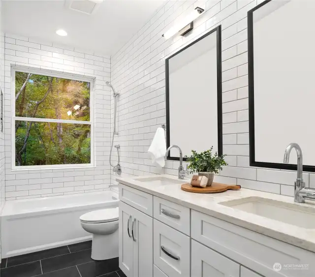 The other full bathroom upstairs also has  heated floors, tiled walls and double sinks  with quartz countertops.
