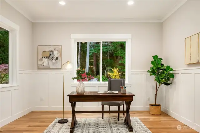 This is one of the two main level office  spaces. Here, off the foyer, with large  windows overlooking both the side yard and  front yard, you'll find it easy to relax and  focus on your work.
