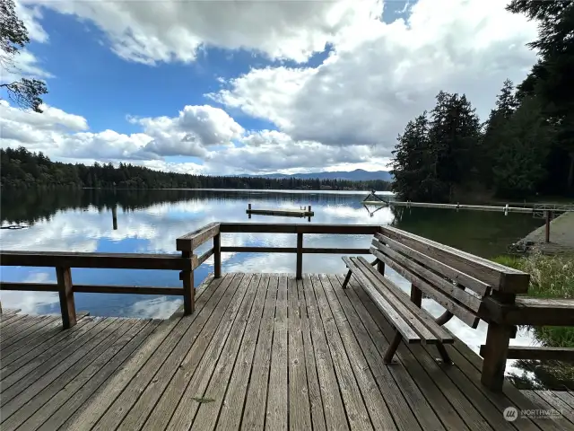 Tranquil sitting area next to lake to enjoy.