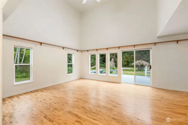 Great room with vaulted ceilings along with the view/access to the back yard.
