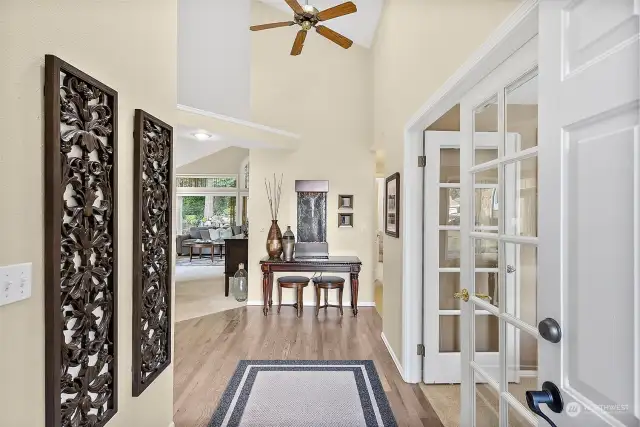 Hardwood floors greet you along with the vaulted ceilings.  The french doors to the right lead to the 2nd bedroom or den, however you would like to utilize this space.
