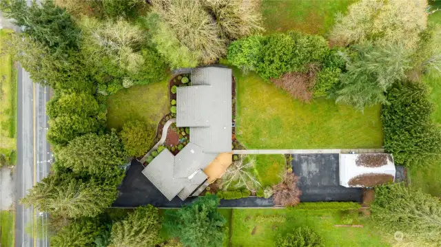 Aerial view on the near 1 acre lot.