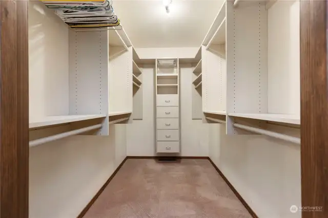 Primary bedroom walk-in closet with built-ins.