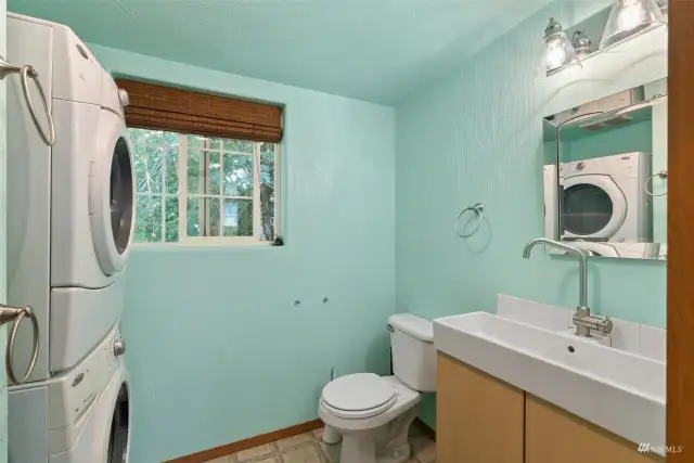 Full-size bathroom with a washer and dryer.