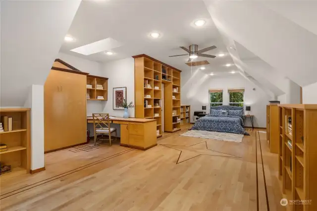 Gleaming hardwood floors and a Murphy bed on the left