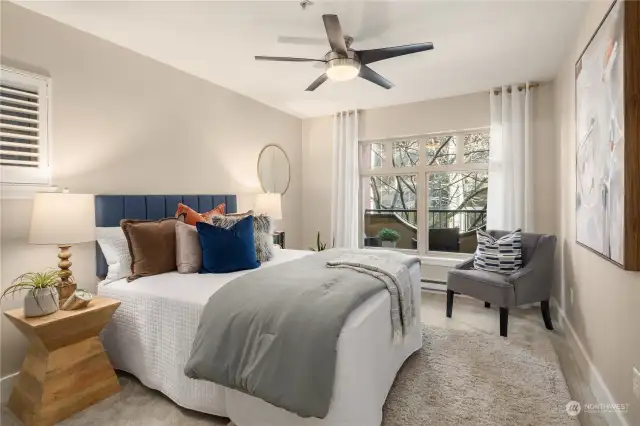 The bedroom is plenty large and features a ceiling fan and dual-exposure windows.