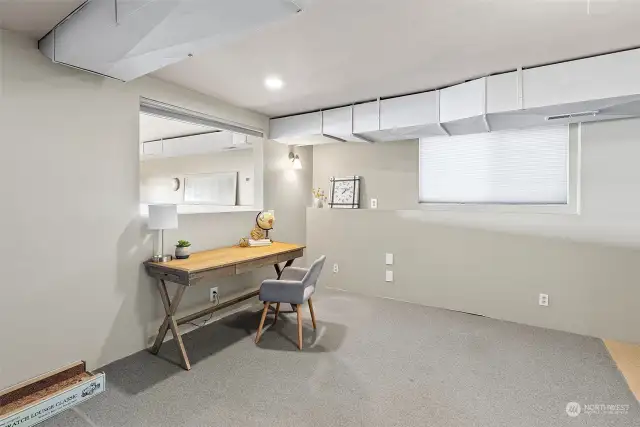 Separate space in daylight basement for office or hobby room.