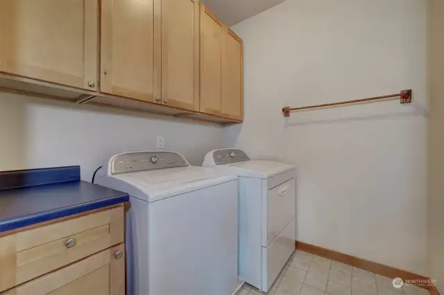 A spacious laundry room is conveniently located close to the bedrooms and on this main floor.