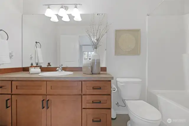 First floor ensuite bathroom with deep soaking tub, lots of counter space and cabinetry!
