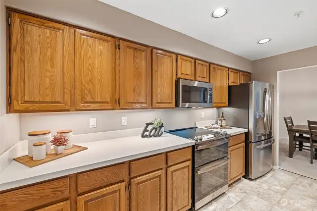 Updated kitchen with Double Oven, Microwave, Quartz Counter, Under Counter Lighting, Stainless Steel Appliances