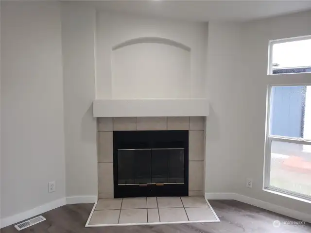 Close of View of the Wood Burning Fireplace with Tile Surround.