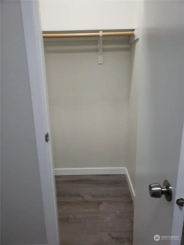 Another View of the Large Utility Room with New Paint, Trim, Showing a Walk In Closet on the Opposite side of the Room.