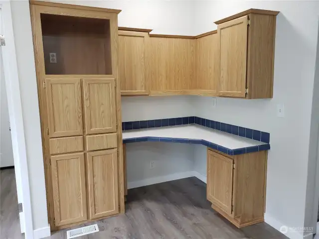 Very Spacious Kitchenette Computer Media Area with Real Oak Wood Cabinets, LED Lighting, New Paint, Trim, and Vinyl Plank Flooring.