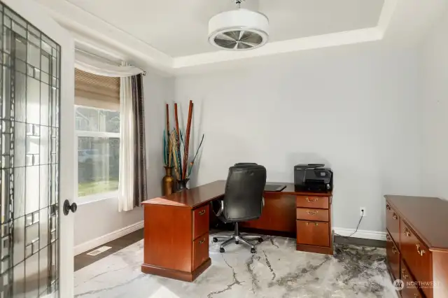 You will love working from home in this office with tray ceiling and leaded & etched glass french doors.