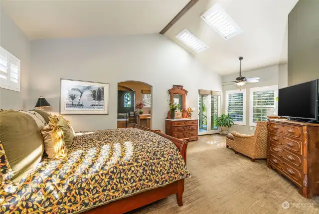 The masters of the home will enjoy this oversized bedroom complete with stylish plantation shutters.  There are even solar powered remote controlled plantation shutters for the skylights.