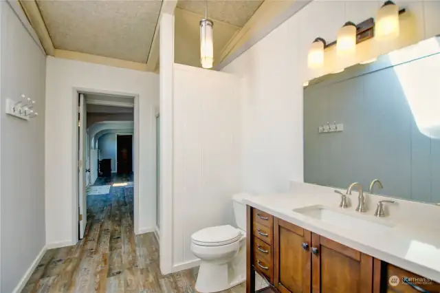 Sky lighted 3/4 bathroom has been remodeled.  Walk through to get to the Bonus Room.