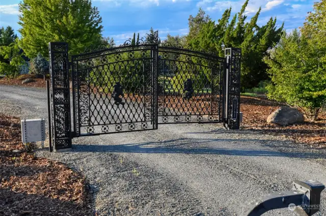 Custom wrought iron drive gate, remote entry