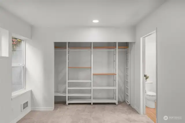The built-in closet space in the primary bedroom allows for easy organization.