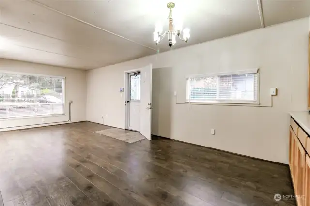 Spacious living area with updating flooring