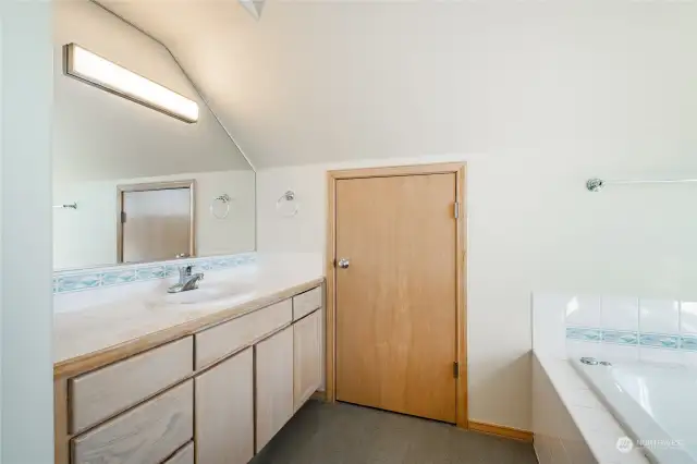 Nice cupboards, sink, and another storage closet.