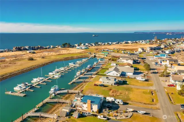 View of the Sandy Point Marina with extra RV and Boat parking area, and Picnic area for private or community events. Come shop at the Night Markets held in the summer.