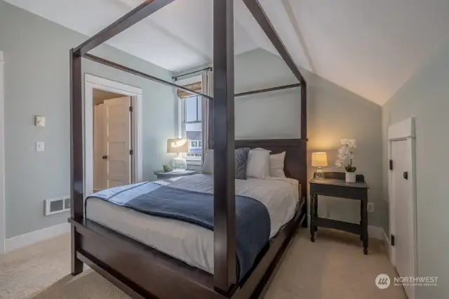 The second upstairs suite offers a poster canopy bed. Another private bath is to the left.  Note:  More attic storage.