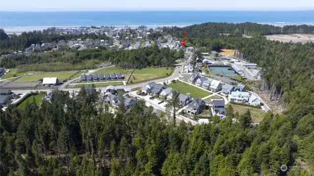 View from the North Farm District.  'A House by the Sea' is near the tennis and pickle ball courts, basketball court and playground and dog park. There are multiple bike and hiking trails that will connect you to the beach and nature.