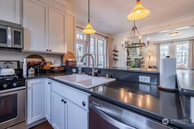The kitchen has ample work space, granite counters and stainless appliances. The bar seating adds a place to sip your morning coffee and plan out your day at the beach.
