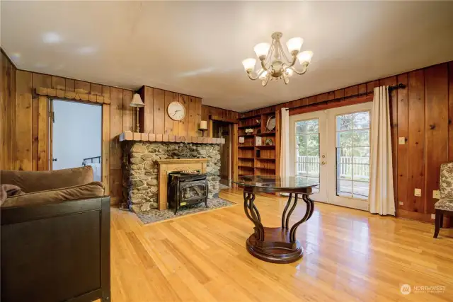 French doors off living room to spacious deck overlooking peaceful, treed setting.