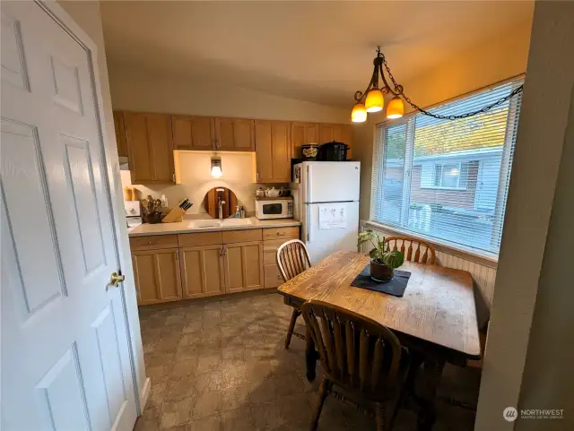 Spacious kitchen with quartz counter tops, eat-in dining area and pantry closet. All Appliances stay. 8414 John Dower Rd SW #3, Lakewood, WA 98499