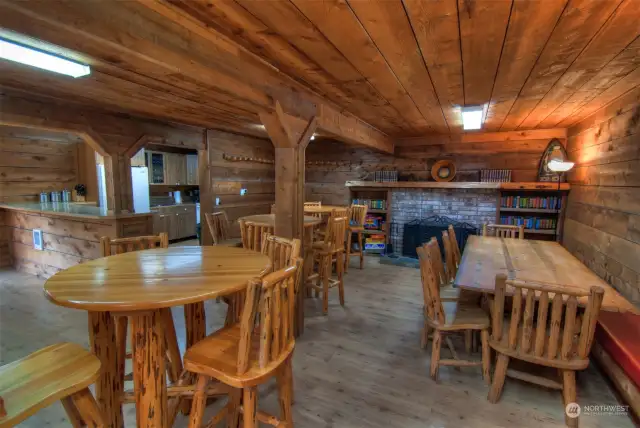 INSIDE THE CLUBHOUSE HAS A FULL KITCHEN TABLES AND CHAIRS