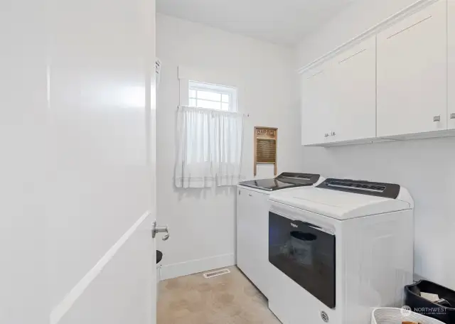 Spacious laundry room with storage to keep things tidy. Washer & Dryer included!