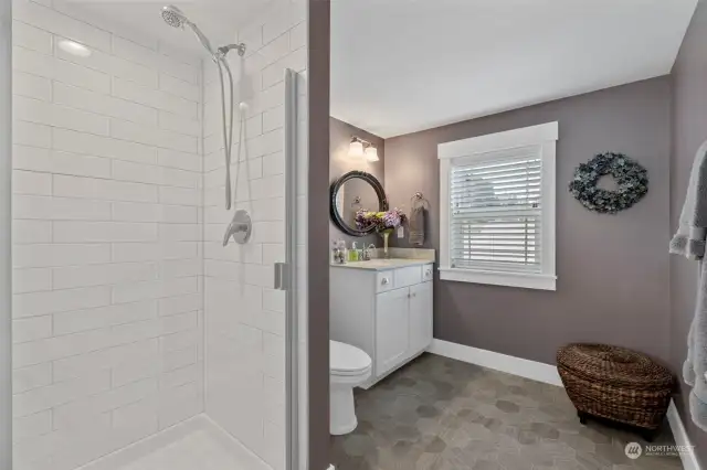 Head on up to the third level with the third bathroom! Custom tiled shower and vanity.