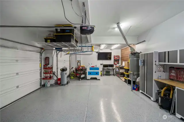 Epoxy floors and updated lighting and storage in this 3 car garage!